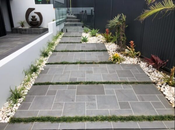 Bluestone french pattern tiles laid in an outdoor area.