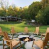 Bluestone stepping stones with wooden chairs and a firepit.