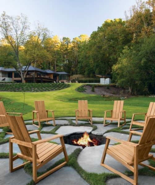 Bluestone stepping stones with wooden chairs and a firepit.