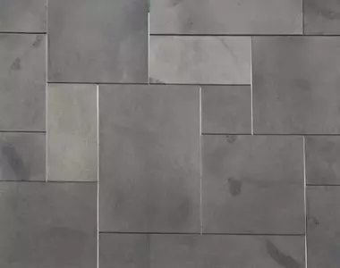 The surface of a Harkaway bluestone French pattern tile.