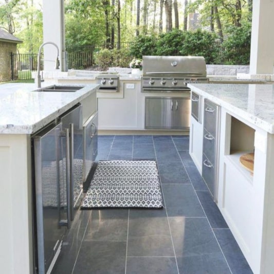 Bluestone kitchen tiles laid in an outdoor kitchen area.